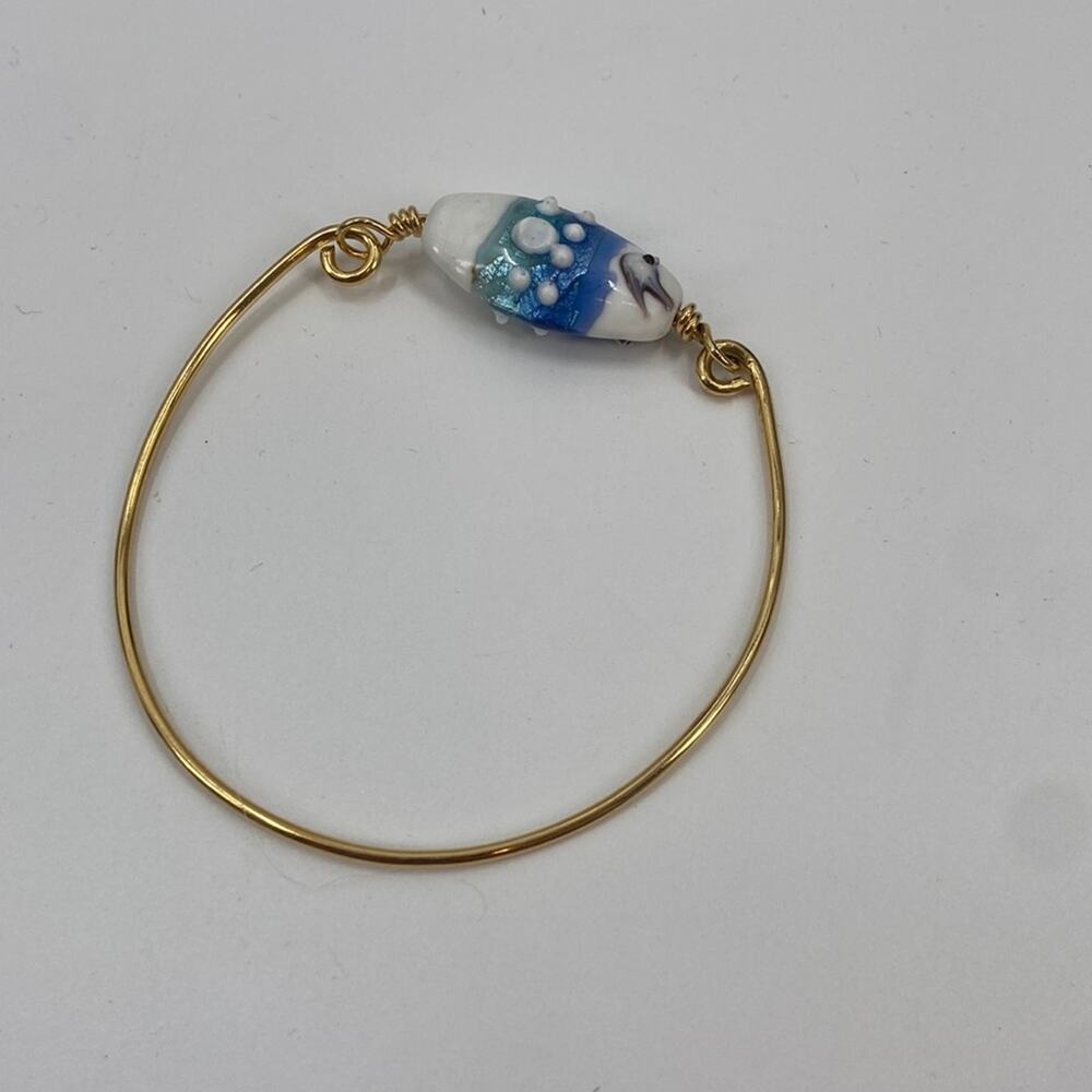 Hand blown glass gold tone wire bracelet
